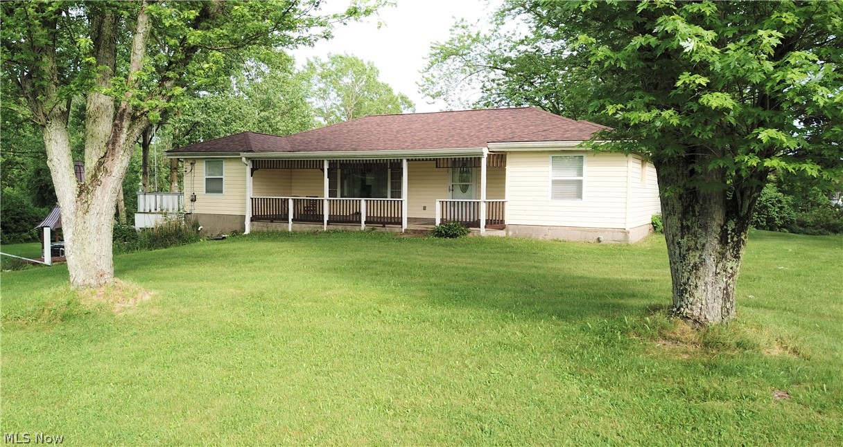 Welcome to 1362 Randolph Road in Mogadore! This 4-bedroom, 3-bathroom home has countless incredible features, both in and outside! The large, eat-in kitchen has newer flooring, ample storage space, and a large window allowing natural light to shine in. Off the kitchen, you’ll find a four-seasons porch with large windows overlooking the beautiful yard. Three bedrooms are located on the main level. The master suite has French doors that lead to a large balcony – it’s a great spot to relax outside! The lower level is a walk-out, complete with a full kitchen, living room area with a brick fireplace, a bedroom, and a full bathroom. Outside, you’ll find a huge garage, a covered back porch, an uncovered deck, a firepit, and a beautiful gazebo. Updates include new roof (2020), new garage roof (2020), windows (2010). The home also has new drywall, trim, and light fixtures. All furnishings are negotiable besides the kitchen table. Shelves in the garage will stay with property. Don’t miss your c