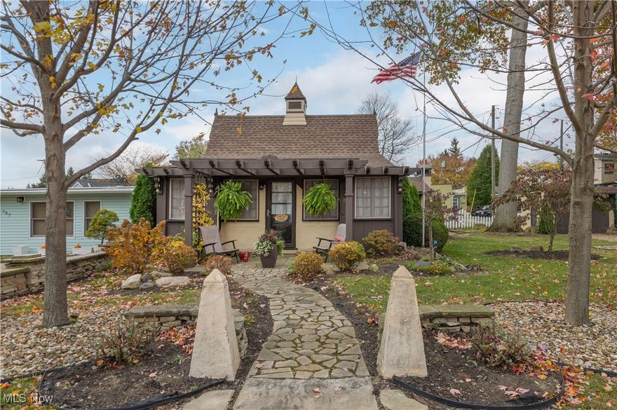 Welcome to a unique opportunity to own a piece of history in Bluebird Beach Vermilion, boasting a private community beach and lake front park. This charming cottage has had only three owners since its construction in 1933. Following a meticulous restoration in 2018, which included new mechanicals and a roof, the property has been lovingly maintained. The interior features elegant wood trim enhancing the 17ft cathedral ceilings and helps accent the spectacular masonry fireplace. Also offering lofted ceiling in one bedroom and a sleeping porch accommodating two beds. The vintage kitchen retains its original cabinetry, while the "bowling alley" hardwood floors are found throughout. A modern bath features a walk-in shower and a jetted whirlpool soaking tub. Outdoor living is enhanced by a summer living room with a wood-burning fireplace. Additional amenities include a one-car garage, low-maintenance landscaping with an array of stunning perennials, and stone walls accenting the property. Architecturally, this cottage is a one-of-a-kind gem that would be difficult to replicate, situated on a double lot with a vintage garage.