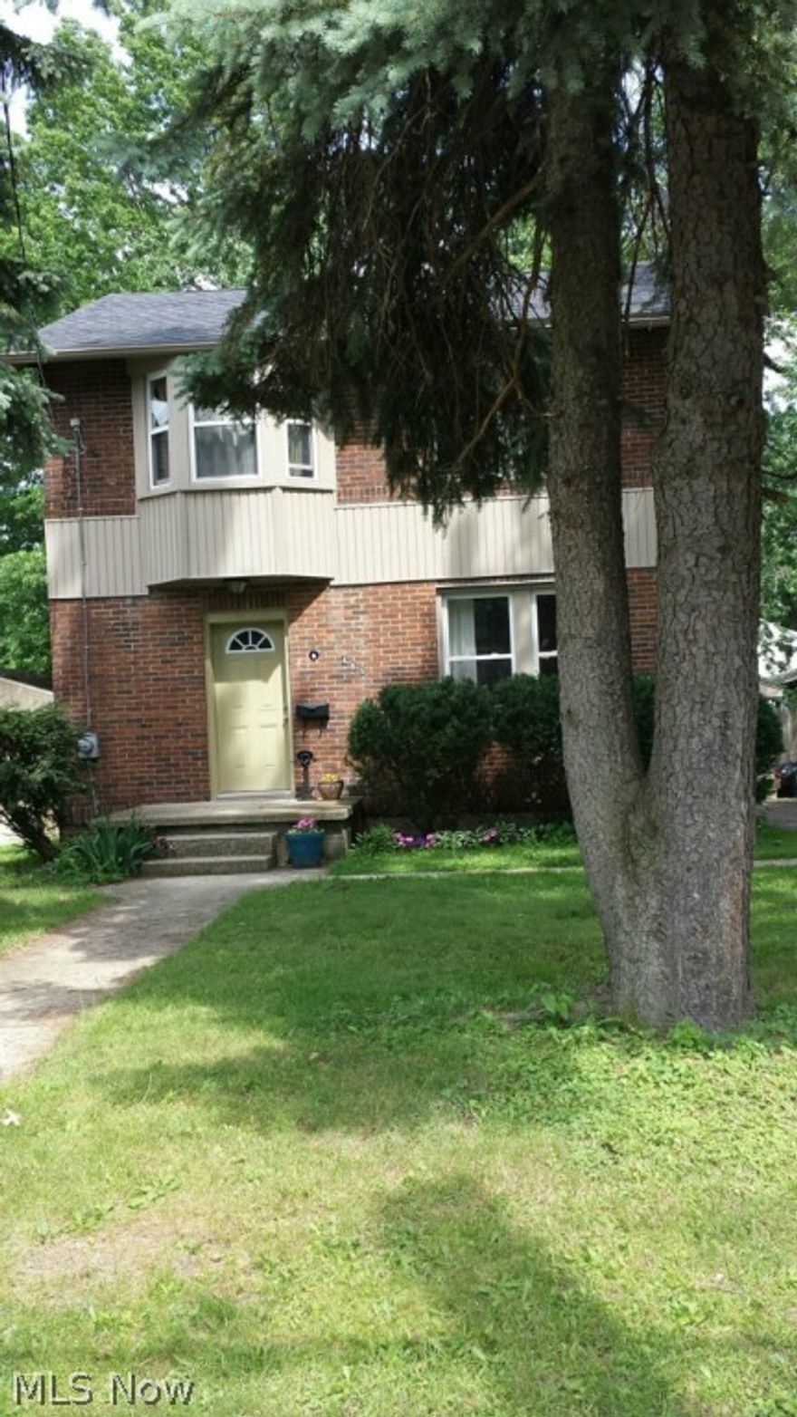 The large entry foyer welcomes you to a tastefully decorated and well maintained brick home with charm and character. The updated bath and kitchen, replacement windows, and newer roof make this home move-in ready. The fireplace is decorative although non working. The fenced back yard and patio are perfect for three season entertaining. Located just minutes from Goodyear Metro Park, shopping and schools makes this home a must see.