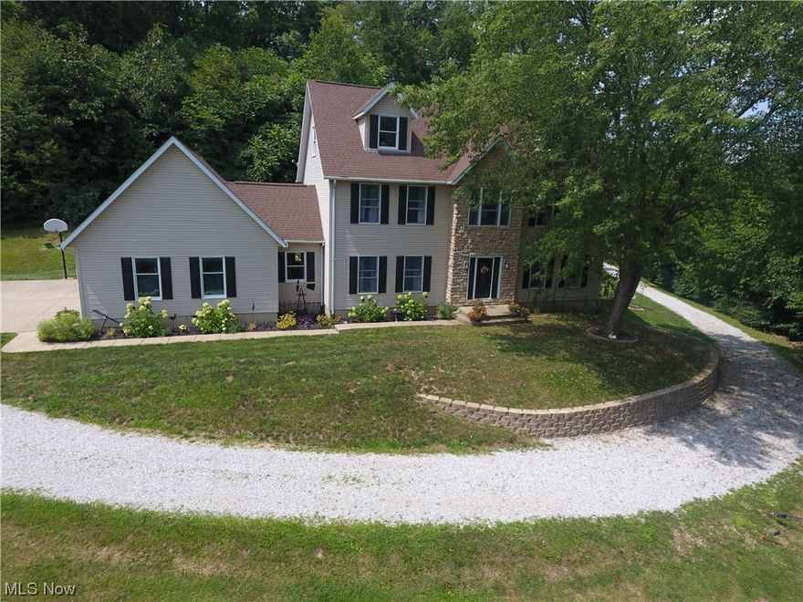 Newly listed is a custom designed Home with four bedrooms, 2.5 bathrooms, formal dining room, eat-in kitchen, patio, deck, Hot-tub, large Family room with a rustic stone wood burning fireplace, attached three car 24'X36' garage all on five beautiful acres overlooking a spring fed creek and wooded lot.  The third floor finished recreational room is a bonus.  Seller's list of some updates include: Deck 2020, Roof 2012, Door knobs 2022, Bathroom updated 2022, Flooring-waterproof laminate, Carpet 1st floor 2021, 2nd & 3rd floor carpet 2023, Interior paint approximately 2 years, Landscaping 2021, Retaining Wall rebuilt 2022, Patio roof added in 2018, Kitchen and appliances updated from 2019-2022, Removed 30 trees/stumps, Hot water heater 2019, Outside 220 hook up for generator 2022, Furnace and ducts serviced/cleaned 2023, Fireplace stonework, mantel, screen, glass doors added 2013, Retractable screen doors 2023.  The basement has 10' ceilings, built with the Superior Wall System using 15,000 PSI Concrete, & insulated walls with furring strips ready for finish. The Master bathroom has a jetted corner tub, shower, and his/hers sinks.  The patio with rustic roof leads to a newly stained deck, and Hot Tub for entertaining and relaxing.  Deer sign are abundant throughout the property. This property has much more to offer than listed.  A must see!  Call for your private showing before its gone.  Please do not drive down the driveway without an appointment.