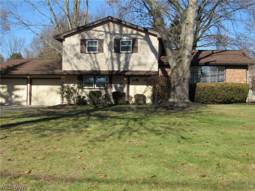 CELEBRATE CHRISTMAS IN YOUR BEAUTIFULLY REMODELED 3 level split with partial basement. 4 bedrooms, 2.5 baths. BRAND NEW AMAZING KITCHEN w/ NEW Stainless appliances. First level laundry w/ new washer & dryer.  NEW carpet and flooring throughout.  Freshly painted neutral interior. New Electric throughout and plumbing updated.  Partial basement is dry with glass block windows. 2 car attached garage, covered rear patio.  The list of all that has been done goes on and on in this home. It is truly a must see to appreciate all the work that has been completed to modernize this property and reflect its move in  condition. Check out the photo's as they can best say what words cannot.