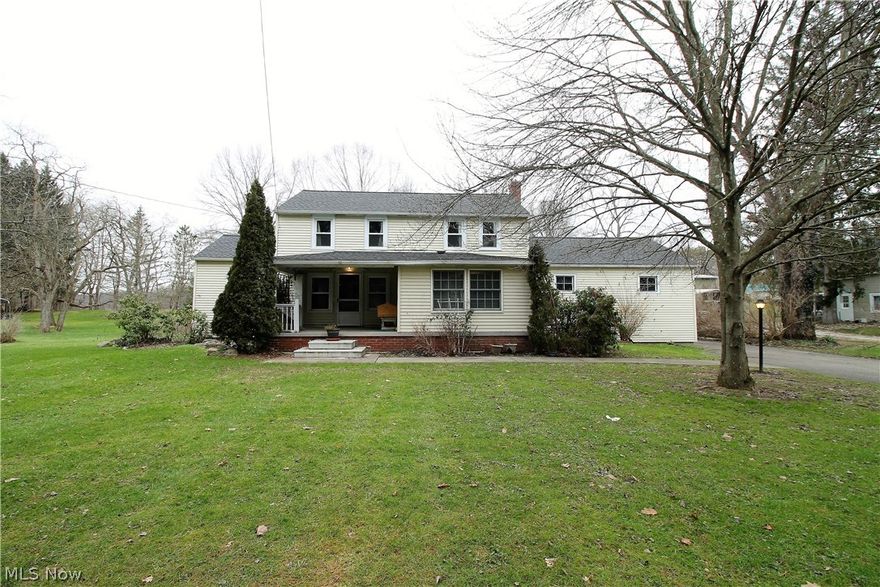 Nothing to do but move right in! Welcome home to this updated charming four bedroom, one full and half bath colonial home on over an acre lot. Come on in through the inviting front porch which has new concrete front steps (2019) to the living room which offers sliders to the huge refinished deck (2019) for relaxing, entertaining and the backyard. So much natural sunlight shines right through. The front room addition offers Travertine tile, and there are wood blinds, hardwood flooring throughout some of  the first floor. The bright, gorgeous, eat in kitchen offers abundant of cabinets and counters, dishwasher and fridge new (2019), new flooring in kitchen and pantry area (2020). There is a half bath and laundry room that finishes the first floor. Upstairs you will find four bedrooms and a remodeled full bathroom (2019). Basement is waterproofed and has a transferable warranty. There are three garages, one below home was done in (2018), attached two car garage with complete second story.