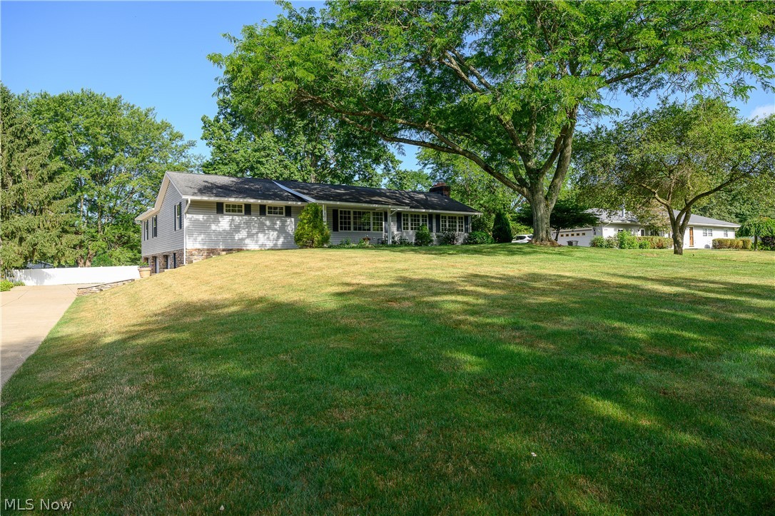 Welcome to this little piece of sunshine on Sunnybrook rd! This meticulously maintained ranch is turn key and ready for you to move in. Upon entering, you are greeted by a spacious living area where natural light cascades through large windows, illuminating the rich wood finishes and highlighting the craftsmanship of the custom woodwork. The open floor plan seamlessly connects the living room to the gourmet kitchen, complete with sleek countertops, neutral appliances and ample storage space. Each of the three bedrooms is thoughtfully designed to provide comfort and relaxation, featuring generous closet space and serene views of the surrounding landscape. The master suite is a retreat in itself, offering a private oasis with a beautifully appointed en-suite bathroom.
Outside, the property continues to impress with its beautifully landscaped grounds and a backyard perfect for outdoor entertaining or quiet relaxation. Imagine summer evenings spent hosting gatherings or simply unwinding in your own private sanctuary.
Located in the sought-after community of Mogadore, this home combines the tranquility of suburban living with convenient access to local amenities and nearby parks. Whether you're enjoying the peaceful surroundings or entertaining guests in style, this residence offers a lifestyle of comfort and sophistication. Be sure to not miss this one!!
