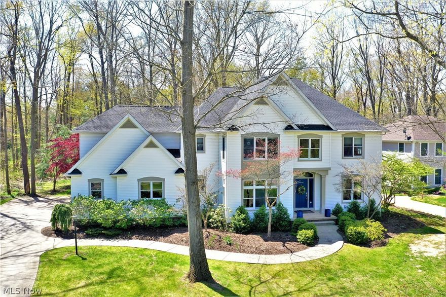 Stunning Custom designed home situated on a private lot in the desirable Willows of Hudson. Quality and attention to detail is apparent from the moment you enter the foyer and are met by a sun-drenched two-story foyer that is flanked by a formal dining room and library that includes handcrafted wood cabinetry. The phenomenal gourmet kitchen boasts granite countertops, handcrafted wood cabinets, large island, top of the line Viking appliances and a wine fridge. The two-story eating area offers panoramic views of park like back yard. The expansive great room is brightened by a wall of windows and warmed by a gas fireplace.  The mud/laundry room also includes handmade cabinets and exits to the 3-car garage.  The second floor features a master bedroom and ensuite 23x14 bath with dual vanities, tub, tiled shower, and walk in closet. Two other bedrooms are served by an adjoining bath and the 4th bedroom has its own bathroom.  All the bedrooms have ample closet space. A theatre room, full kit