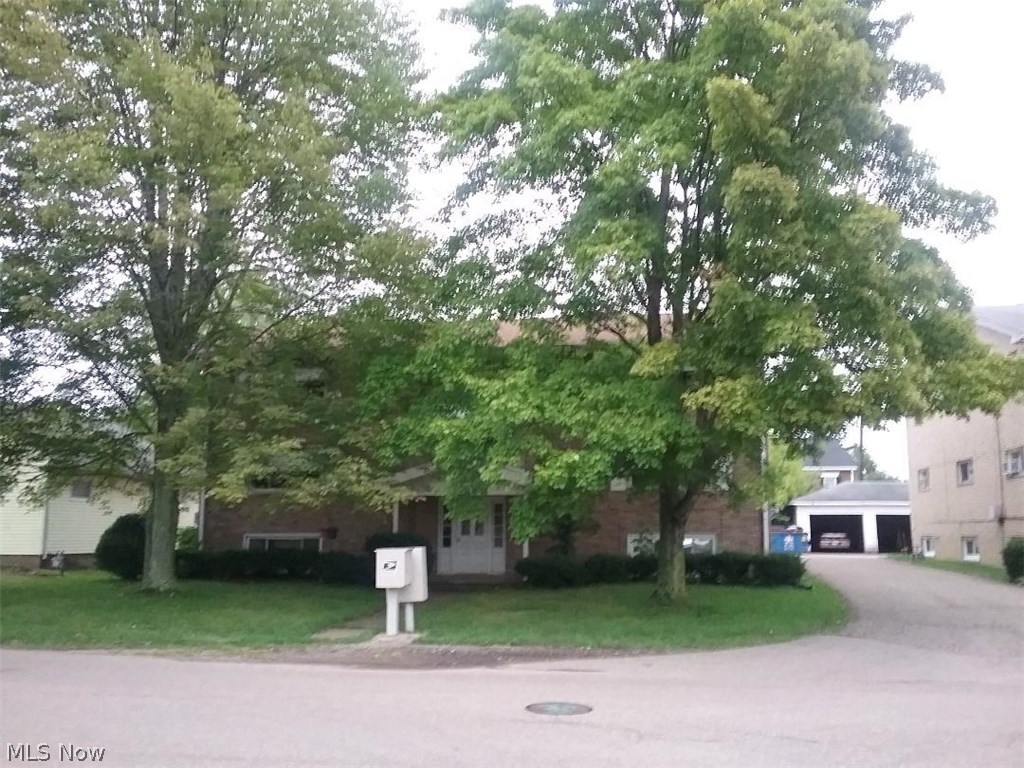 All brick building with 6 two bedroom, one bath units in charming Hartville. Six bay carport. Separate electric-gas fired hot water heat. Roof-complete tear off-of apartment building and carports in 2009.