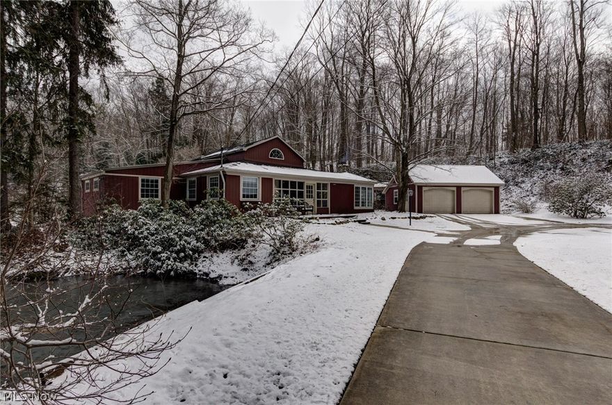 Imagine, Your Home Nestled in 3.5 acres Landscaped by Nature with the Music of the River & Your Very Own Waterfall! Next to a stream fed stocked pond, an enclosed porch leads you inside. Exposed beams & character throughout. A Stone wood burning fireplace enhances a wormy chestnut accented living rm. Thoughtful office/mudroom w/hardwood floor has endless views of rear oasis. Master kitchen features, vaulted ceiling, cork flooring, abundant custom Knotty Pine Cabinetry, Vermont Soap Stone Counters, Stainless Steel Viking Stove/Fridge & wood burning stove.1st Island w/prep sink & breakfast bar & 2nd more cabinetry. Spiral steps to a creative loft space. 1st flr Laundry remodeled ’12. Updated Full bath has soaking tub/shower & hardwood flooring. Skylight in Library w/decorative fireplace, built in wood shelving & hardwood flooring offer that perfect reading place. Master Suite includes beamed ceiling, large windows & door to rear deck/hot tub. Private Master Bath updated w/heated floors &