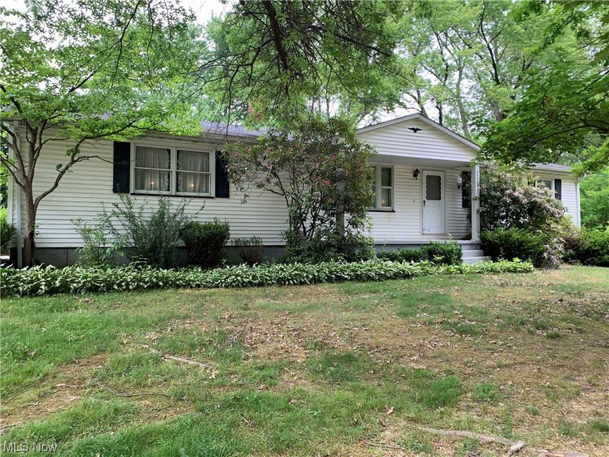 1960 Ranch home of approximately 1,040 square feet. Vinyl siding, shingle roof, black top driveway. Oak kitchen with dinette and linoleum flooring. Carpeted living room with large windows. Full bath. Three carpeted bedrooms with closets. Full finished basement with rec room, full kitchen, laundry room with shower and electric baseboard heat. 1 ½ car attached garage with concrete floor and overhead door. 12x12 garden shed.  Enclosed back patio. 
Large corner lot of approx. .4527 acres with hardwood shade trees. City Utilities. 

Note: Home is in need of Remodeling.