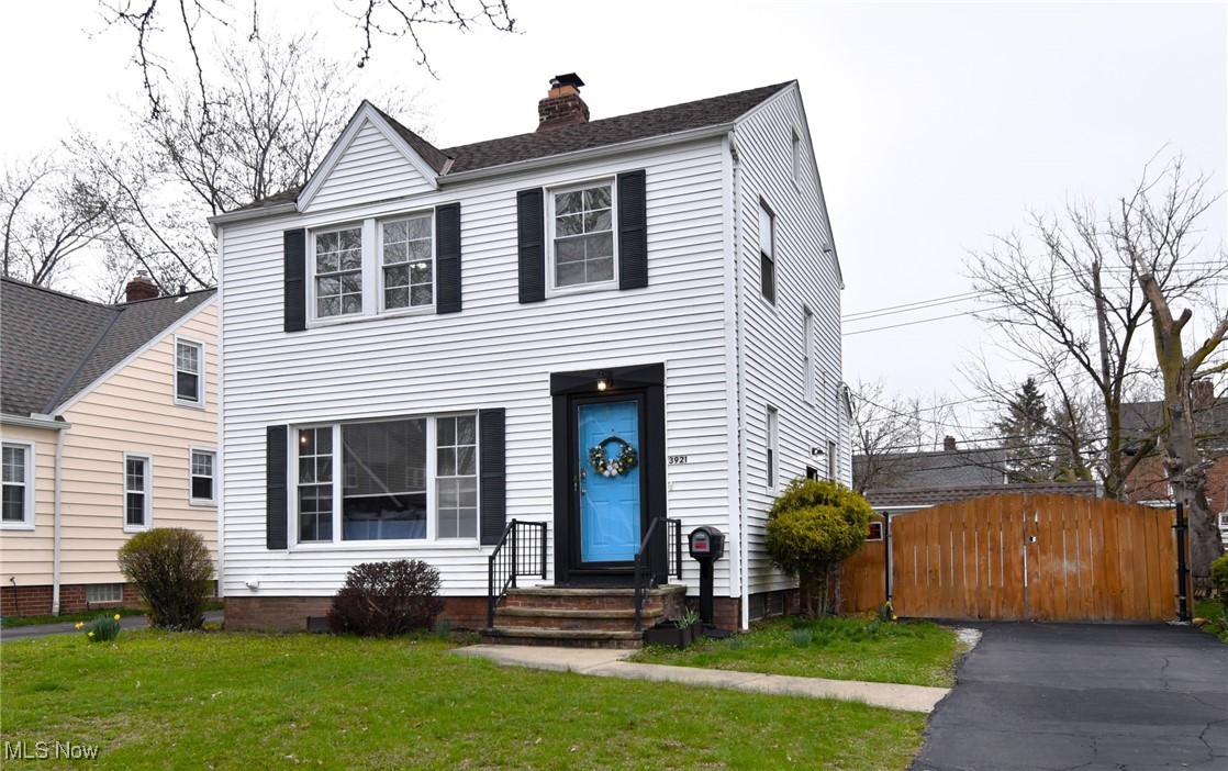 This charming home in South Euclid offers a welcoming first impression, complete with a custom-painted blue door. Inside, you'll find abundant natural light highlighting the cove molding on the main floor. The spacious living room flows into a dining area featuring a dry bar and wine fridge. There's also a bonus mudroom leading to a lovely back deck, perfect for enjoying your morning coffee. The home boasts original woodwork, built-ins, and freshly painted walls throughout. The kitchen is large, with plenty of cabinet space. Additionally, central air has been recently updated in the home (2024). Upstairs, new carpet on the steps leads to three generously sized bedrooms and a recently updated bathroom, with a new vanity, mirror, and light fixtures (2024). The primary bedroom offers a private balcony for complete relaxation. The lower level is partially finished, featuring a full bathroom and a separate laundry area. Outside, the property is fenced in for privacy, with a recently sealed driveway (2024) and a large wooden gate securing the backyard. Located in a great neighborhood near schools, parks, and shopping, this home is a perfect blend of charm and convenience.