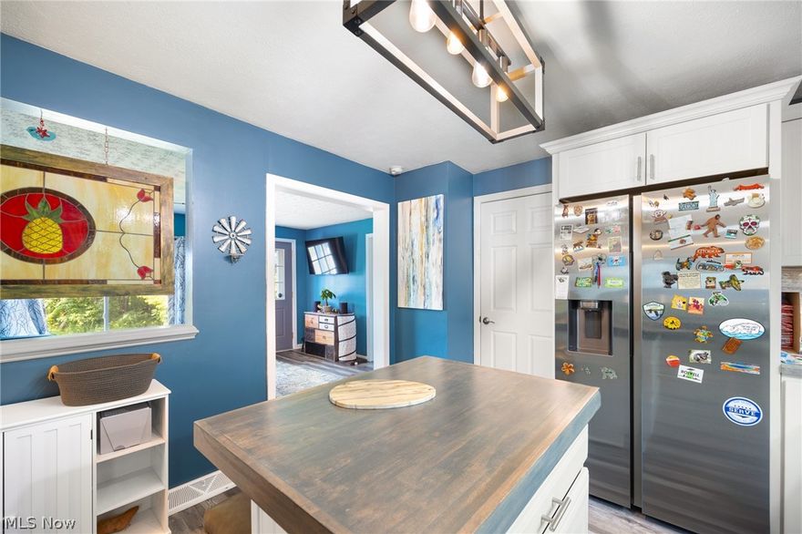 Embrace your new home, featuring a charming 3-bedroom, 1-bath main house, complemented by a 2-bedroom apartment above an expansive 3+ car garage. Also included is a spacious 22x14x12 shed equipped with 220-watt power. Recent updates include a fence and a new metal roof in 2020, along with central air, windows, and all-new kitchen appliances installed in 2023. Siding and insulation was 2022 and basement was Waterproofed in 2023. Move right in and savor the serene fenced backyard boasting a fire pit and pergola, an ideal setting for relaxation.