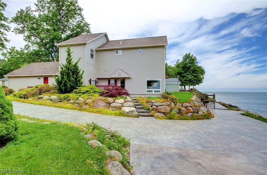 This home is turnkey but also has so much more possibilities to add instant value! Currently your master is on the top floor overlooking a gorgeous view but there is room to add a 1st floor master that would be attached the existing full bath on the first floor. This beautiful 4 bedroom home includes “2” LOTS with a 2nd family room. Imagine your view from this LAKEFRONT HOME! Over $80k was just invested, creating the winding stamped concrete drive down to a newly fortified breakwall, & includes a stairway, to maximize lake accessibility. A large concrete patio sits atop the breakwall & is perfect for lakeside cookouts or watching fireworks! Located in charming Vermilion, this is your opportunity to enjoy Lake Erie front living or convert into an AirBnB that is already in high demand because of its location.This home is 1 minute from beach access, & close to Marina's, Restaurants & Downtown! The living room has a dramatic vaulted wood ceiling with a cozy fireplace & big windows (that co