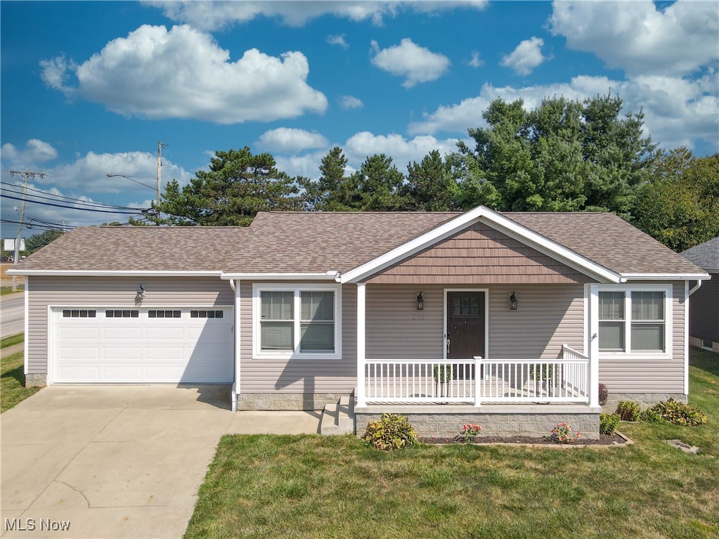 This charming Ranch home in Barberton offers convenient one-floor living with a spacious layout. The open concept living room, kitchen, and dining area create a welcoming atmosphere, perfect for entertaining or relaxing. The kitchen features high-quality cabinetry, stainless steel appliances, and durable LVT flooring. Step outside from the dining area onto the deck for outdoor enjoyment. Two generously sized bedrooms and a full bathroom on the main floor provide comfortable accommodations. The laundry room adds convenience to daily tasks. Downstairs, a finished living room and additional full bathroom offer extra space for recreation or guests. An unfinished storage area provides ample room for organization. Completing the property is a 2-car attached garage for parking and storage needs. Don't miss out on the opportunity to make this adorable home yours - schedule a showing today!