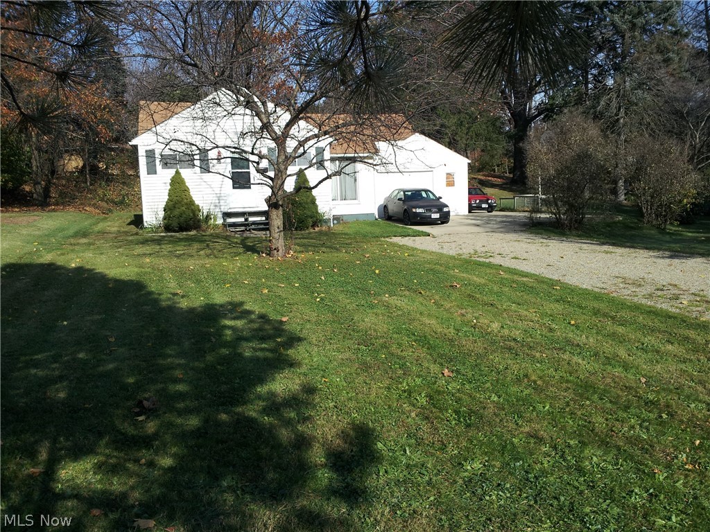 1230 Square Foot Ranch home on a double lot in Kent with a 1 1/2 car garage. The attic is larger than normal, its is floored, partially finished and great for extra storage. This is not added in the 1230 square feet but in addition to that square footage. There is also a dry basement for extra storage. The attached garage is a 1 1/2 car garage with a work bench that stays. Nice oversized lot that is 94 feet wide by 150 feet deep. Located at the end of North River road in Stow. So you have quick access to Stow, Kent, Cuyahoga Falls, Munroe Falls or Akron. Close to Kent State Campus, Food, Shopping, Parks, Bike Trails, Kayaking and schools. Call for your private showing today!