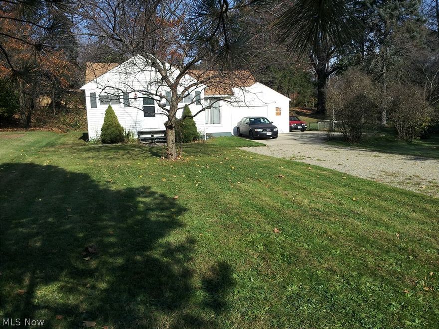 1230 Square Foot Ranch home on a double lot in Kent with a 1 1/2 car garage. The attic is larger than normal, its is floored, partially finished and great for extra storage. This is not added in the 1230 square feet but in addition to that square footage. There is also a  dry basement for extra storage. The attached garage is a 1 1/2 car garage with a work bench that stays. Nice oversized lot that is 94 feet wide by 150 feet deep. Located at the end of North River road in Stow. So you have quick access to Stow, Kent, Cuyahoga Falls, Munroe Falls or Akron. Close to Kent State Campus, Food, Shopping, Parks, Bike Trails, Kayaking and schools. Call for your private showing today!