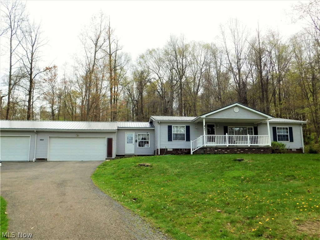 Looking for the simpler life, then look no farther. This 3 Bedroom, 2 bath home in an affordable country setting awaits for you. This place has a little bit of everything. There is a attached two car garage, a larger back deck, and two hook ups for washer and dryer. Also a brand new metal roof, gutters, and gutter helmets, and finally a blacktop driveway. All of this rests on 2.5 acres. Schedule your showing today!