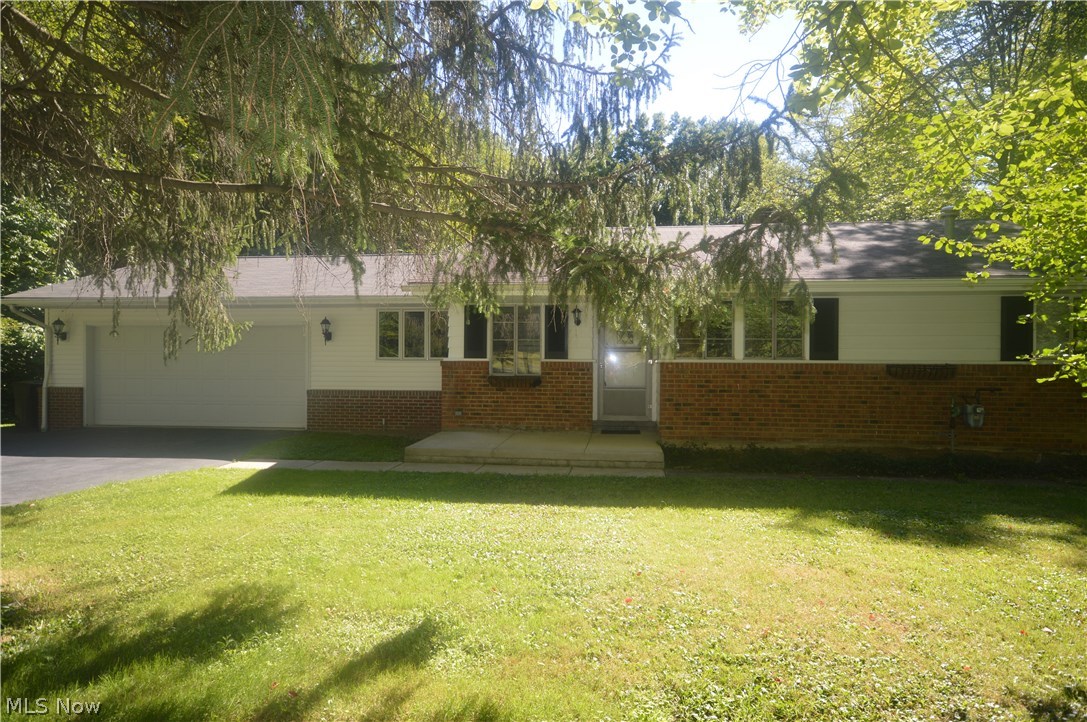 Welcome to private living at its best in Orange Village! Come and view this charming ranch on almost two acres that back up to the golf course of the famous Chagrin Valley Country Club! As you drive up you will notice the beautiful trees and spacious driveway with great views from the front porch. The living room hosts a grand fireplace, built-in book shelves and a great view of the nature in this back yard. There are two spacious bedrooms and a bathroom. The utility room is large with access to outside. The kitchen has been updated with new counter tops and a lovely space for an eat in kitchen. There is a spacious breezeway area with a large closet as you make your way to the garage area. This home has plenty of upgrades including new roof and well in 1997, new septic system in 2003, 2-car garage and breezeway addition in 2004. It has been maintained with care and is awaiting its new owner. Great opportunity and plenty of land whether you have a vision to renovate or a dream to expand