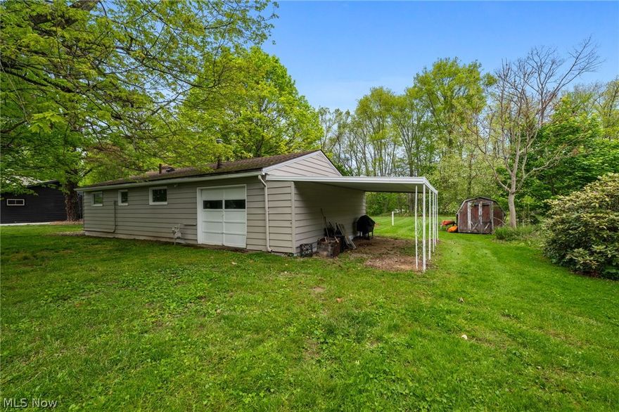 Looking for a lake cottage with an included boat with trailer?   This home in the Atwood Valley community at Atwood Lake is situated on a private 100x100 lot that adjoins the lakefront Muskingum Watershed Conservancy District.  This 2-bedroom home has a renovated bath 2020 with new shower, vanity, commode & fixtures.  The kitchen was renovated with new cabinetry & butcher block counters in 2025 & is open to the living room with wood burning fireplace. The four-seasons room with lake views is a great place to relax on summer days.   Additional features & updates include: LVP flooring throughout 2020, updated electric panel & incoming service to home 2020, storage shed, garage with front & rear overhead doors, attached carport for additional covered storage, public sewer; all appliances, furnishings, kayaks, 14-ft boat with trailer & 12-Month Home Warranty Included!  Boat docking rights are available within the Atwood Valley Dock Association(subject to availability) allowing owner the opportunity to access dock approximately 200ft from the back of property.  Set up your showing today!