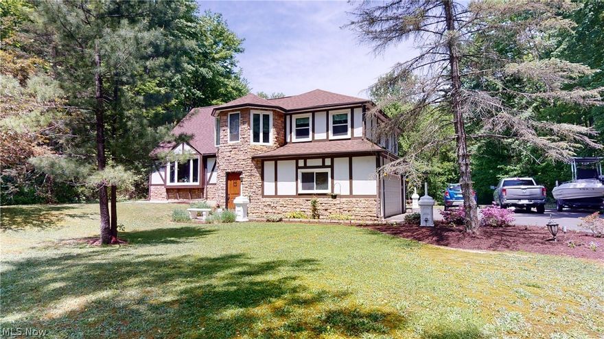 *CASTLE IN THE WOODS* Charming home in a tranquil setting on 4 acres. Just move in and start enjoying the beautiful property or visit one of the many local wineries. This is a 5 level split with 3-4 bedrooms and two full baths. A beautiful stone walkway lined with flower beds leads to the front door. On the ground floor is a cozy Family Room that has new carpet and a fireplace with a pellet insert. Laundry room is also on this floor. A sliding door leads to a covered back patio overlooking the park-like yard. A few steps up leads to a light and bright living room with a huge picture window to allow lots of natural light. The kitchen has Corian countertops and a double oven for holiday baking. All appliances stay with the home. Upstairs there are 3 bedrooms. The "turret" bedroom has so much character. The owners suite has new drywall and trim. The en suite was taken down to the studs and totally remodeled including adding green board, new shower with glass doors, new toilet and custom v