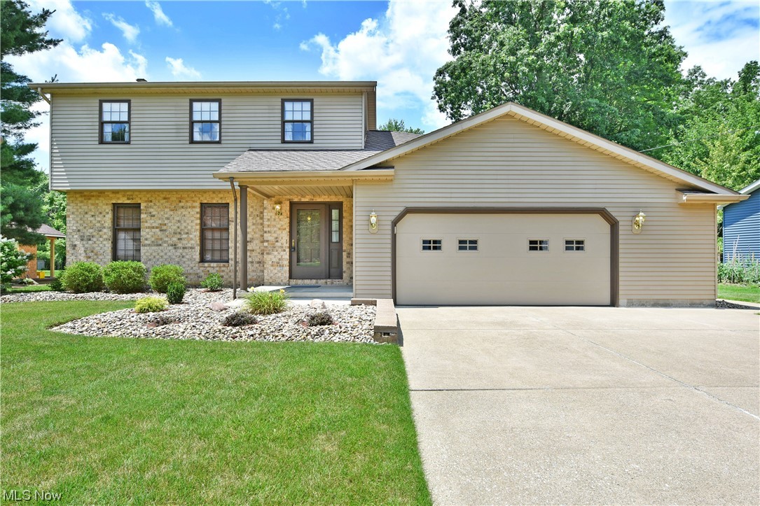 Handsome stonework and a partial brick façade grace this gorgeous Poland residence, move-in-ready and waiting for you! Nestled deeply in a quiet development, this perfectly kept home will quickly grab your attention with its picture-perfect appearance and impressive concrete driveway. Around back, a fenced patio space offsets a window lined sunroom for four season enjoyment. Step inside the tiled foyer as a stained wood staircase rises to the second-floor bedrooms. A lovely half bath awaits the kitchen as a posh family room wraps around to meet the formal dining area at the far corner. The central kitchen includes its engaging wood cabinetry, offset by white appliances and casual, eat-in dining. A remarkable carpeted living room completes the floor with its brick mantle, fireplace and built-in cabinets. Sliding doors offer easy sunroom access. Upstairs, an oversized full bath is found at the landing, showcasing a large shower and private master bedroom access. A walk-in closet hides ne