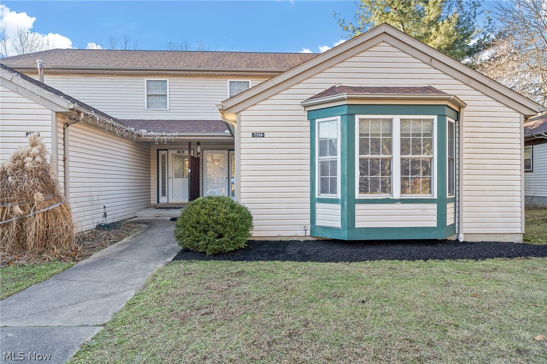 Comfortable rarely available end unit tucked away in a private location, yet very convenient location overlooking the Tuscarawas River and the Metro Park System. Freshly painted with new neutral LTV flooring. 3 bedroom 2.5 bath first floor laundry 2 car attached garage. Imagine how you would feel living here in a tranquil comfortable setting, walking neighborhood, hike, bike, kayak and nature lovers. The floor plan is unique and lives quite well, wide open foyer, large kitchen with an open living & dining room. Depending on your preferences this offers complete first floor living with en suite on the first floor or choose the one on the second floor. As an added bonus the basement in pre plumbed for another bath, numerous large walk in closets, plenty of storage. Be sure to put this on your must-see list.