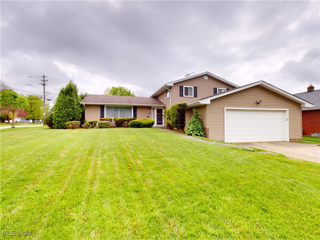 Spacious One-Owner Home on a Prime Corner Lot in Lyndhurst! This well-loved, one-owner home is full of personality, space, and potential! Located on a beautifully maintained corner lot with great curb appeal and newer siding, this 4-bedroom home also features a flexible 5th bedroom, office, or den on the lower level—perfect for today’s lifestyle needs. Enter and imagine the possibilities: the living room and formal dining room offer a traditional layout with rich character, while the eat-in kitchen is tucked behind classic pocket doors—ready for your personal touch. Under the carpet, you’ll find hardwood floors in the bedrooms and even some tile flooring in other areas, just waiting to be uncovered. The lower-level family room is a standout space with custom built-in cabinets, warm wood paneling, and a large sliding glass door that opens to the patio and backyard—ideal for entertaining or relaxing. Upstairs, the spacious layout includes three bedrooms plus a large primary suite with a walk-in closet and full bath. Great closet space throughout, including hidden storage access, adds to the home’s smart design. The laundry/utility/mudroom area is freshly updated with new carpet and paint, and the attached 2-car garage adds convenience. With 2 full baths, 1 half bath, and over 2,000 square feet of living space, this home is a rare find. Located just minutes from Legacy Village, Acacia Reservation, Brainard Park, Beachwood Place, and Hillcrest Hospital. With shopping, dining, tennis courts, and freeway access nearby, the location is hard to beat. Bring your vision and schedule your showing today- this home is full of possibilities!