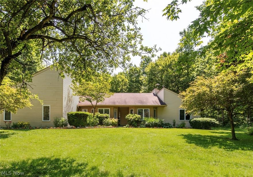 You can have all the beauty of the country with all the luxuries included in this spacious four bedroom three bath home positioned on 2+ acres. This home boasts natural light in every space with its 8 sky lights and cathedral ceilings. Expansive eat in kitchen complete with a breakfast bar. Entertain your friends and family on one of the two covered screened in patios complete with 900 square foot Trex Deck. Take the time to relax in your master suite where you will find your walk in closet and soaking tub. Also offers the possibility of an in law or teen suite with a separate entrance as well as kitchenette.  Septic system passed by Geauga County on 7/15/2019.