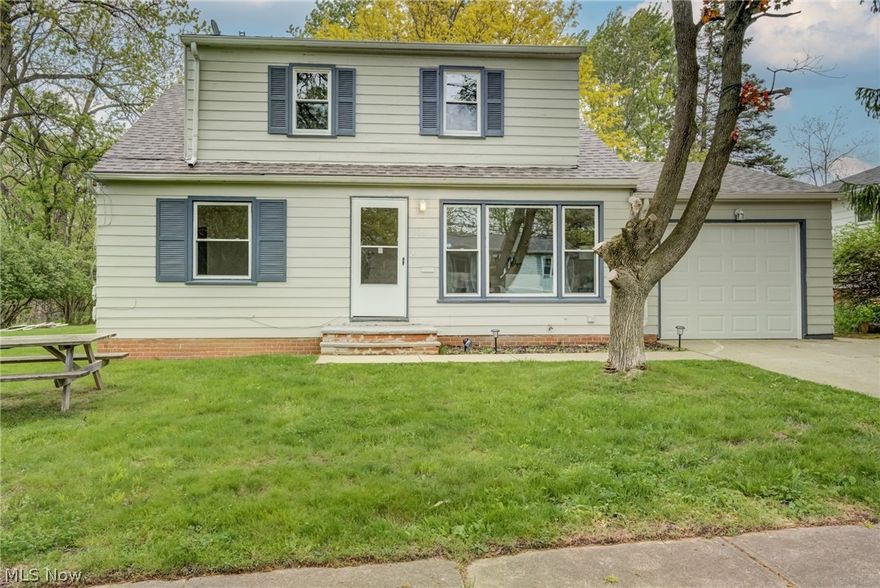 Beautifully updated and move-in ready Cape Cod in the heart of Maple Heights! This spacious 4-bedroom, 1.5-bath home offers over 1,800 square feet above grade plus a full unfinished basement, providing plenty of room for living, storage, or future expansion. The bright and inviting interior features a large living area with abundant natural light, neutral décor, and attractive wood-finish flooring throughout much of the main level. The eat-in kitchen is equipped with stainless steel appliances, updated cabinetry, and ample dining space perfect for everyday living and entertaining. Two bedrooms are conveniently located on the main floor, with additional generously sized bedrooms upstairs. Enjoy central air, forced-air heating, a 1-car attached garage, and a spacious backyard with mature trees and patio area ideal for outdoor gatherings. Conveniently located near schools, shopping, parks, and major highways. A great opportunity to own a well-maintained home with space, comfort, and value!