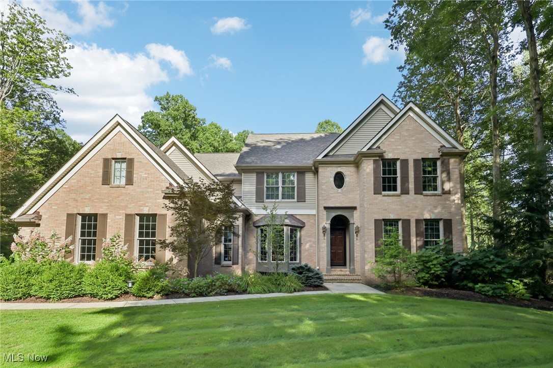 Welcome to this bright and inviting 4-bedroom colonial, custom-built with timeless design and exceptional craftsmanship, and lovingly owned by only two owners. Perfectly nestled on 2.5 lush acres in a quiet cul-de-sac neighborhood within the highly rated Kenston School District, this home offers the peace of no through traffic while being just minutes from the freeway for easy commuting.
Step inside the foyer and immediately appreciate the 9-foot ceilings that enhance the open, airy feel of the main level. The first floor showcases new hardwood floors (2023), a private office, full bath, formal dining room, first-floor laundry, and a cozy living room featuring a gas fireplace with black walnut mantle and custom cherry built-ins. The expansive kitchen is a true highlight with cherry cabinetry, a large island with seating, casual dining area, access to the back deck, and breathtaking views of the private backyard—ideal for entertaining.
Upstairs, you’ll find four spacious bedrooms and a full bath with double vanity. The owner’s suite is a retreat of its own, complete with tray ceilings, a spa-like glamour bath with dual sinks, a soaking tub with serene views, walk-in glass shower, and a generous walk-in closet.
The finished walk-out lower level offers a versatile family/rec room, plenty of storage, and two sets of doors opening to a covered patio and the expansive yard, beautifully private when the trees are in full bloom.
Notable updates include a new roof, gutters, and gutter guards (2023) and a new water heater (2019). Throughout the home, you’ll find Anderson windows, crown molding, and remarkable woodwork that highlight the quality craftsmanship.
This is the perfect blend of privacy, convenience, and timeless style—don’t miss it!