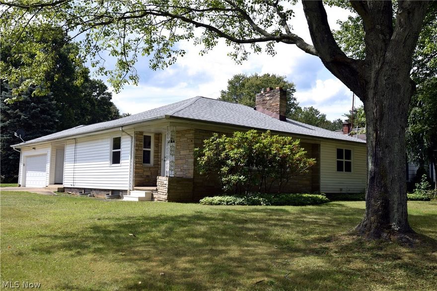 This freshly updated ranch home has it all from the moment you walk in the door. Elegant hardwood flooring runs throughout the home, starting from the main entrance way, near where the formal dining area is located. A massive picture window brightens the living room where a brick mantle and fireplace is found. In the newly updated kitchen, you’re greeted by large tile flooring, stark white cabinets contrast the glass back splash here, while all new stainless appliances are found between new counter tops. From here, entrances to the lower level and a small hall with bath, joining the master bedroom, can be found. The hall also is home to a half bath, also completely remodeled with intricate tile work and large vanity. The adjacent master bedroom features large closets and a deceivingly deep layout for maximum space. Wrapping around outside, the remaining two bedrooms are divided by a first floor master bath. Each bedroom is substantial in appearance and offer ample closet space. The mas