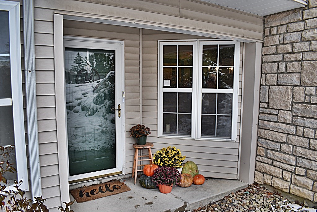 You're going to fall in love with this home!!! Step into the private front entrance and you'll have views of the large open floor plan. Living Room with Fireplace, windows that face private wooded area and door that leads to private covered patio that faces wooded area. Family Room, office or possible third bedroom is next to the gorgeous living room and offers so many options. Kitchen with white cabinetry, plenty of counter space, breakfast bar and opens to eating area / dining room with built-ins. This home has it all! Master Bedroom suite has large walk-in closet and full Master Bath. Second Bedroom is also nice size and has access to the second full bath across the hall. In-suite Laundry and attached Garage complete this wonderful home. Newer composite wood / laminate flooring through-out Living areas, fresh paint in all rooms, Remodeled guest bath with newer flooring and vanity, custom built-ins in Dining room/ eat in area, newer cabinets installed in Laundry Room and add