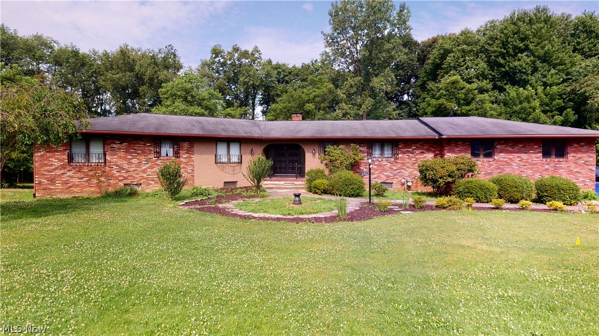Unbelievable 1-family owned 2020 sqft Ranch with 1198 sqft in finished, walk-out lower level on 1.911 acres!! Sprawling rooms include formal sunken living room and dining room, both with beamed ceilings and oversized windows overlooking backyard and creek. Huge applianced kitchen has large eating area with sliders to small deck overlooking backyard, island, desk, window overlooking front yard, entry to attached 2-1/2-car garage, and second staircase to 2nd kitchen/laundry room. Remaining first floor includes 3 big bedrooms including master bedroom with walk-in closet and 2-part master bathroom, main full bathroom with double sinks and grand foyer entrance with other staircase to finished lower level. Lower level could be additional living suite with giant fireplaced family room with sliders to patio, possible 4th bedroom, full bathroom with step-in shower, 2nd kitchen/laundry room combo, large rec room, wine storage room, furnace room/workshop with 2nd walk-out to patio. The overs