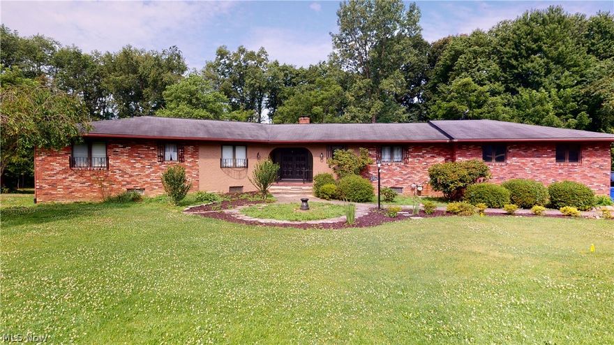 Unbelievable 1-family owned 2020 sqft Ranch with 1198 sqft in finished, walk-out lower level on 1.911 acres!!  Sprawling rooms include formal sunken living room and dining room, both with beamed ceilings and oversized windows overlooking backyard and creek.  Huge applianced kitchen has large eating area with sliders to small deck overlooking backyard, island, desk, window overlooking front yard, entry to attached 2-1/2-car garage, and second staircase to 2nd kitchen/laundry room.  Remaining first floor includes 3 big bedrooms including master bedroom with walk-in closet and 2-part master bathroom, main full bathroom with double sinks and grand foyer entrance with other staircase to finished lower level.  Lower level could be additional living suite with giant fireplaced family room with sliders to patio, possible 4th bedroom, full bathroom with step-in shower, 2nd kitchen/laundry room combo, large rec room, wine storage room, furnace room/workshop with 2nd walk-out to patio.  The overs