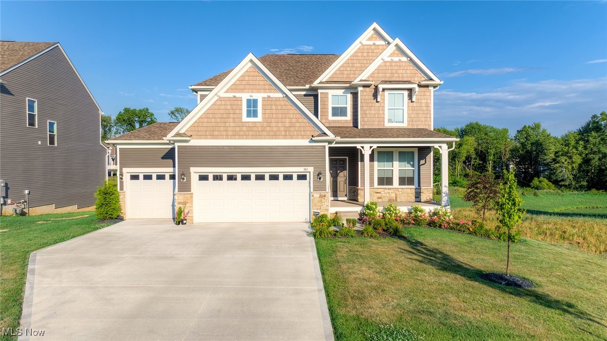 **Welcome to 3815 Jacob Lane, nestled in the new Jacob's Ridge development in the City of Green!** This stunning colonial, built in 2024, is packed with upgrades and modern features. Step inside to find 9-foot ceilings throughout, creating a spacious and airy feel.The gourmet kitchen is a showstopper, featuring an oversized island with quartz countertops, herringbone subway tile backsplash, soft-close cabinetry, a stainless steel vent hood, and all stainless steel appliances—which are included! A convenient butler’s pantry sits just off the kitchen, and the eat-in dining area opens to a brand-new composite deck, added in March 2025.Recessed lighting and luxury vinyl tile (LVT) flooring run throughout the first floor. The family room includes a bump-out extension for added space and comfort. There's also a versatile flex room on the main level, perfect as a guest bedroom or office, plus a mudroom with a built-in desk, storage closet, and access to the attached three-car garage.Upstairs, a spacious loft area offers the ideal space for lounging, gaming, studying, or watching TV. You'll find four generously sized bedrooms and a convenient second-floor laundry room. The primary suite includes a bonus room/flex space, two walk-in closets, and a luxurious en suite bath with a large walk-in shower, dual vanities with quartz countertops, a private water closet, and LVT flooring. The large basement includes egress windows, offering plenty of potential for future finishing. Additional perks include a homeowners association fee that covers cable and internet—and a **5% interest rate ASSUMABLE MORTGAGE** makes this an exceptional opportunity you won’t want to miss!