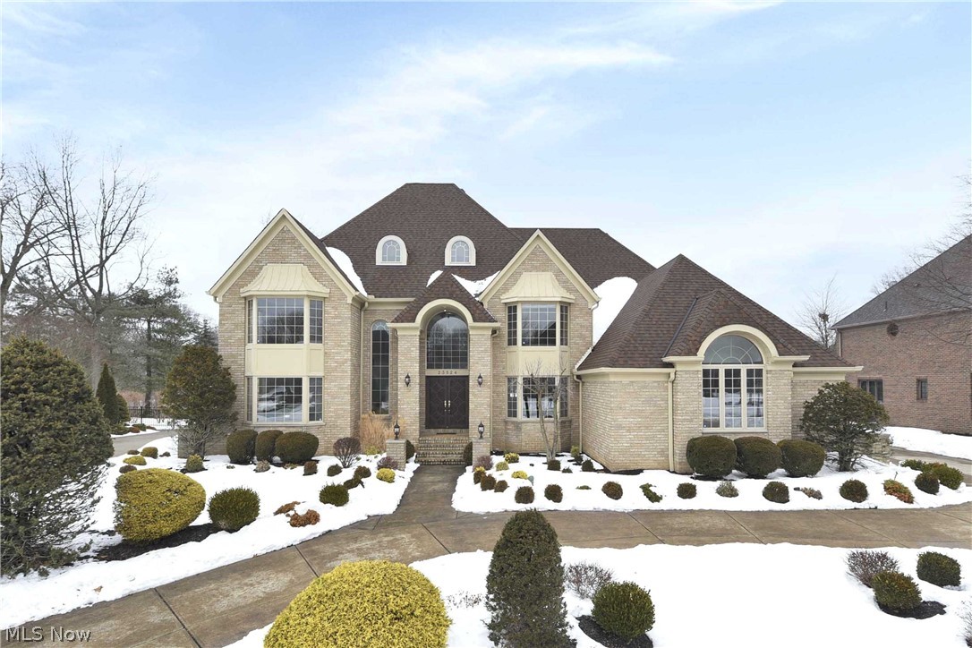 Prepare to be Moved!...into this stunning Quail Hollow Valore built colonial with circular driveway! Grand 2-story foyer opens to the living and dining rooms. The spacious eat-in kitchen features huge windows and slider doors for maximum light. Gather around the center island/breakfast bar for a quick bite or casual party buffet. Classic hardwood floors flow from the kitchen to the family room and into the library/study. The 2-story family room featuring gas fireplace continues the bright and airy feel with a wall of windows overlooking the wooded backyard. First floor bedroom with full bath, laundry room and convenient half-bath complete the first level. Expansive upstairs loft overlooks the family room. This Master Suite let the stresses of the day disappear in the relaxing Jacuzzi tub. Separate shower, double vanity with tons of cabinet storage along with huge walk in closet round out the master. Abundant natural light from oversize windows fills the other three bedrooms each with t