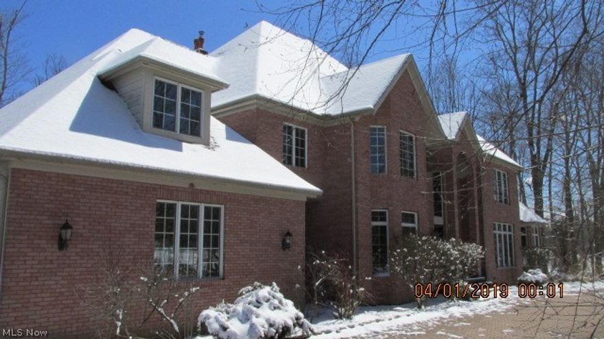 Set on 5 wooded rolling acres, in an area of estate-sized homes, this all-brick colonial offers tremendous potential. Dramatic open spaces, generous room sizes and a wonderful, functional floorplan. 2-story Great Room includes fireplace & wet bar. Formal Dining Room. Living Room with marble flooring is an ideal flexible space, with myriad uses, as your music room or private Office.  Corian Kitchen highlights include marble tile floor, cherry Kraftmaid cabinetry and pantry, fireplace, Amana gas cooktop, double ovens, vegetable sink, refrigerator, builit-in desk and bay-windowed eating area. 1st floor Master features 2 enormous walk-in closets, plus 18 x 12 Master Bath with jetted tub & separate shower. 1st floor Library or Den with fireplace & bay window. 1st floor laundry. 4 huge bedrooms each with private full baths on second floor. As a bonus there is a 33' Loft with easy access to attic storage. Features of note throughout include: 5 fireplaces, bay windows, crown moldings, wood-pan