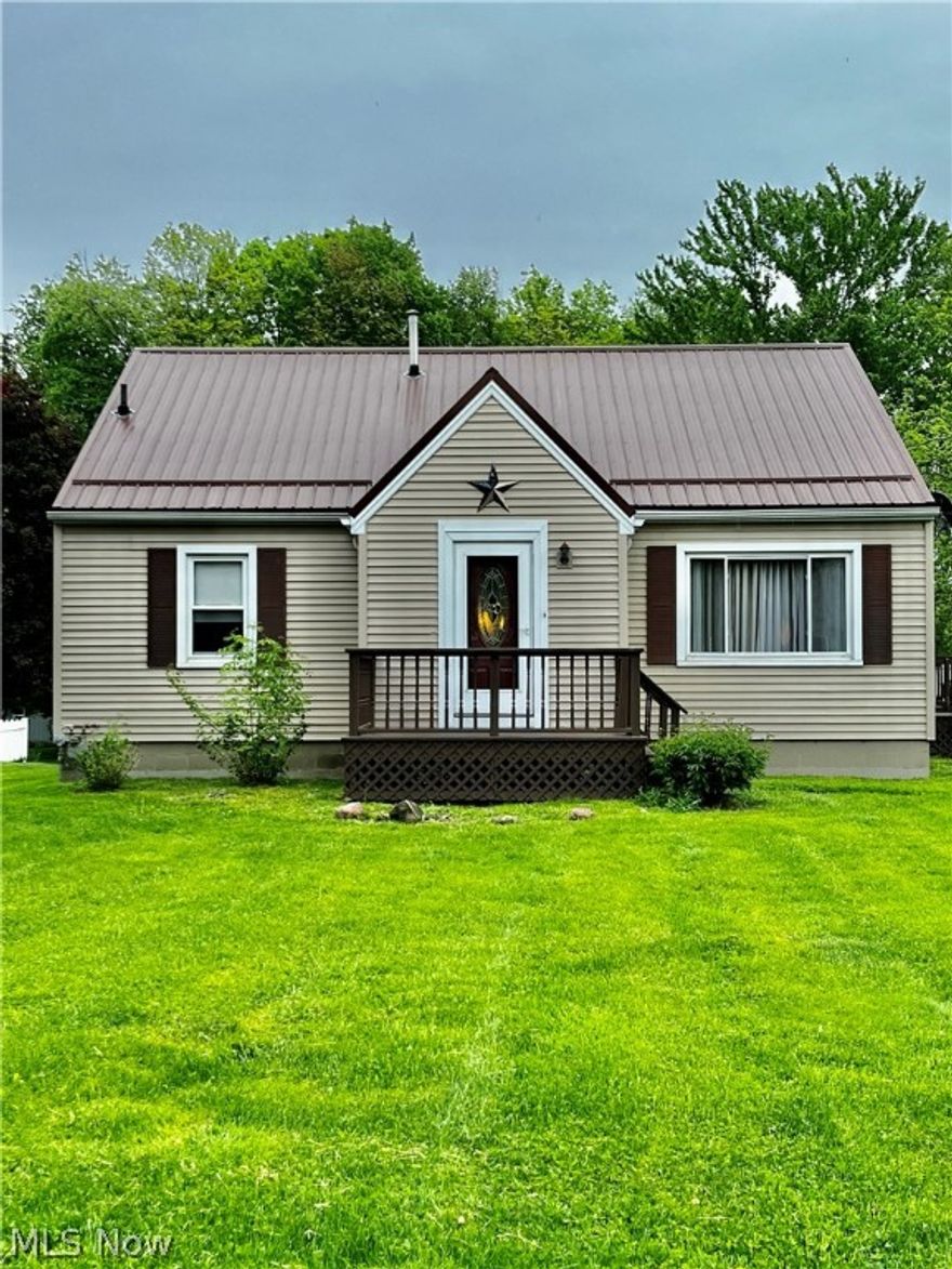 Welcome to this perfectly placed gem close to all amenities! This home boasts large living room, 3 bedrooms, kitchen and dining room with original hard wood flooring! Full unfinished basement offers plenty of storage! Enjoy the summer weather relaxing on the rear deck or front porch. Paved driveway leads to a 2 car detached garage. New metal roof in 2017!