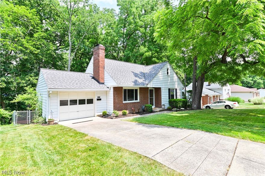Move in ready!  Beautifully updated 3 bedroom 2 bath West Akron Cape with private back yard situated next to Akron Metro park. Bright fully renovated eat-in kitchen with quartz countertops, tile backsplash, new cabinets, luxury vinyl floor, and new appliances.  Beautifully refinished hardwood flooring throughout the house, wood-burning fireplace, and fully remodeled bathrooms. Walk-out finished basement with patio in a private fully fenced yard with park views. All new fixtures throughout, newer windows, and newer roof with leaf filter gutters.  New hot water tank. Updated furnace/AC and Lifetime warranty on basement waterproofing