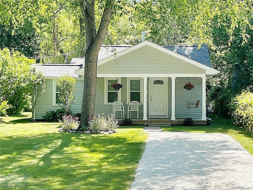 Put your money to work for you in this expertly-remodeled, 2-bedroom Munroe Falls ranch where you won't have to lift a finger! You'll love the super sharp living areas, which include newer windows, doors, flooring and paint. The kitchen appliances will make cooking easy. There's even a brand new over-the-range microwave and a dining room nearby. You'll appreciate the HVAC system, the electrical updates, the vinyl windows, the water heater is newer and there's even a stackable washer and dryer for added convenience. If you're just starting out, are downsizing or are looking for an alternative to dorm, apartment or condo living, the house will be perfect. You're within 15 minutes of both KSU and the University of Akron, and highway access to Cleveland and Canton isn't far away. When it comes to favorite covered front porches, this one will probably end up on the top of your list. 19-ft. long and as pretty as can be, you'll be able to step out at the end of a hard day and sit for hours, relaxing with friends or family. The front porch swing even comes with the house! For hosting larger events, you're within walking distance to Galt Park, a wonderful neighborhood park featuring a playground, picnic tables and a lodge you can rent, with a stone fireplace and kitchen. Make plans to see this one today. You won't want to let it pass you by!
