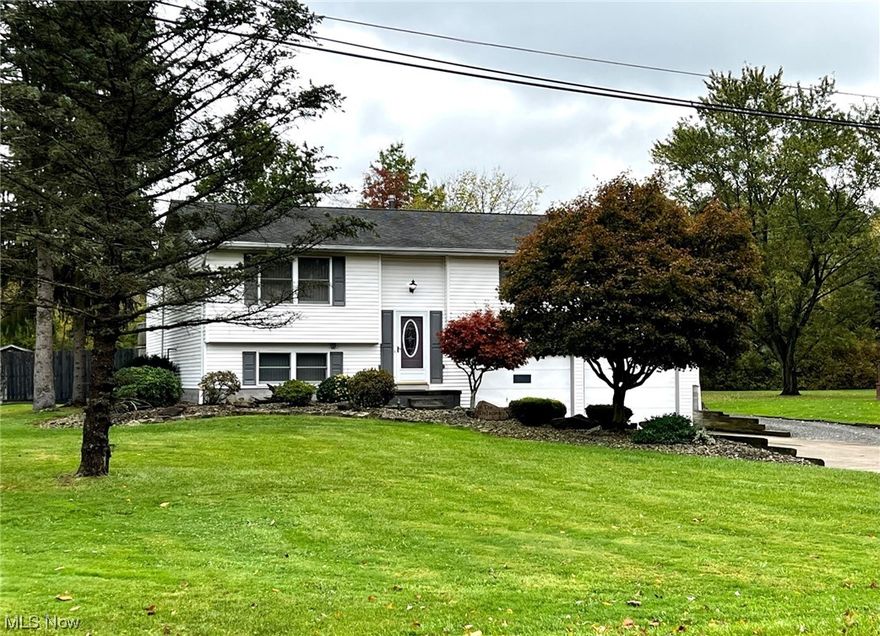 This remarkable home, on over an acre in Cortland,  has been beautifully updated with a new open kitchen featuring a large island, stainless appliances, granite counters & luxury vinyl flooring.  There is newer carpet in the living room & family room, and 3 spacious bedrooms & a remodeled full bath are located on the opposite side of the home. The lower level features a family room with a gas fireplace, full bath, laundry room, and a large storage room. There is a large deck on the back of the home, overlooking an expansive backyard with a firepit, flower gardens, and a 24 x 55 heated storage building with a separate driveway! Don't miss this rare find!