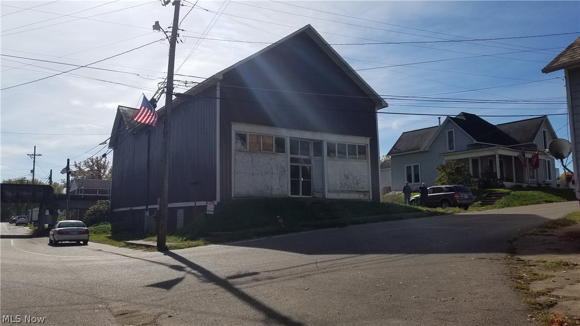 Own a piece of History, built in 1850 this building has served the community in many different capacities. The buildings main floor maintains the original wood floors and ceilings with decorative metal crown moldings. There is a x side garage door on the main floor to bring in large items and The building sits along the train tracks. There is an outside entrance to the 2nd floor and attic access. The basement entry in on the Main Street side through the 3 side doors. The basement floors are dirt and walls are old sandstone walls. Some walls have been braced with new concrete block walls. Large wooden beams have been purchased for enforcing the floors and are stored in the basement part of the building. Property being sold As Is. All offers will be considered.