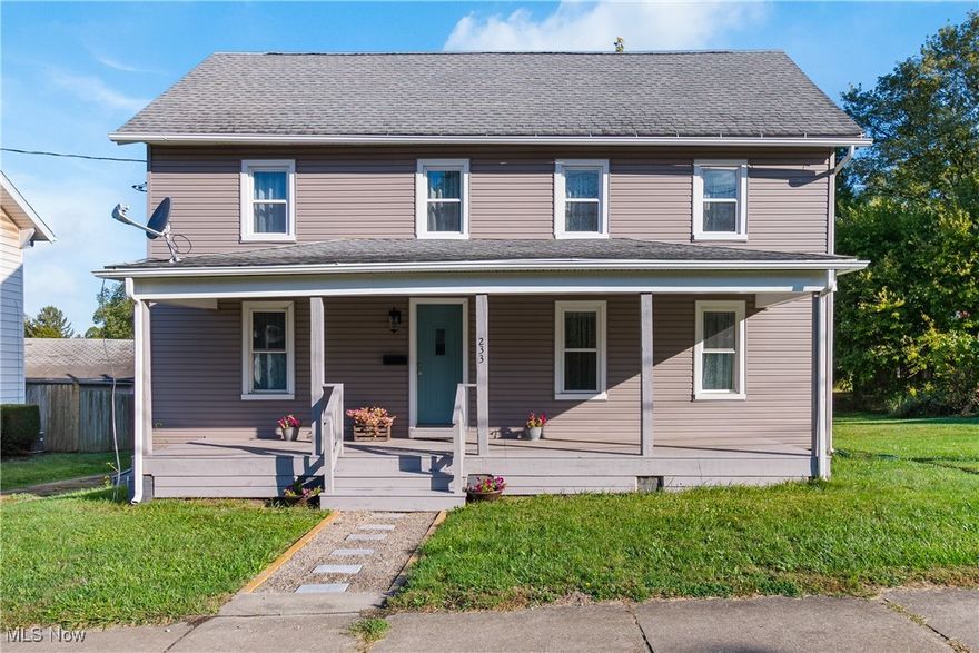 Stunningly beautiful!! This home is worthy of a magazine feature! With extensive, careful renovations it is like buying new with the warm beauty found in historic homes! From the covered front porch, step into the main living space with oversized, versatile rooms. The kitchen is completely new: cabinets, counters, backsplash, sink, floor, appliances, and more! A deck off the kitchen overlooks the huge yard. A half bath has been added to the main floor and it accommodates a stackable washer and dryer. Two versatile spaces separated by a step offer flexibility for dining/living areas. A 17x7' main floor bedroom has been created using beautiful sliding doors, it would also make a great office space. The cute and cozy upstairs has two bedrooms. The large master bedroom was created by combining two smaller bedrooms. There is also a large bathroom and additional bedroom on the second floor. An unfinished walk-up attic holds potential for storage or more! The basement has tall ceilings and glass block windows. This is situated on two parcels for a total of .385 acre. Beginning in 2022, the whole house has received all new electrical wiring, flooring, windows, siding, hot water tank, high-efficiency furnace, central air added, ductwork added, cabinets, toilets, faucets, sinks, 96 sheets of drywall, refinished woodwork, and so much more! It has 200 amp electrical. This historic home in East Canton has been carefully improved in every way with convenient upgrades while preserving beautiful original wood and details to showcase its historic beauty. Schedule your showing today - you're going to absolutely love what you see!