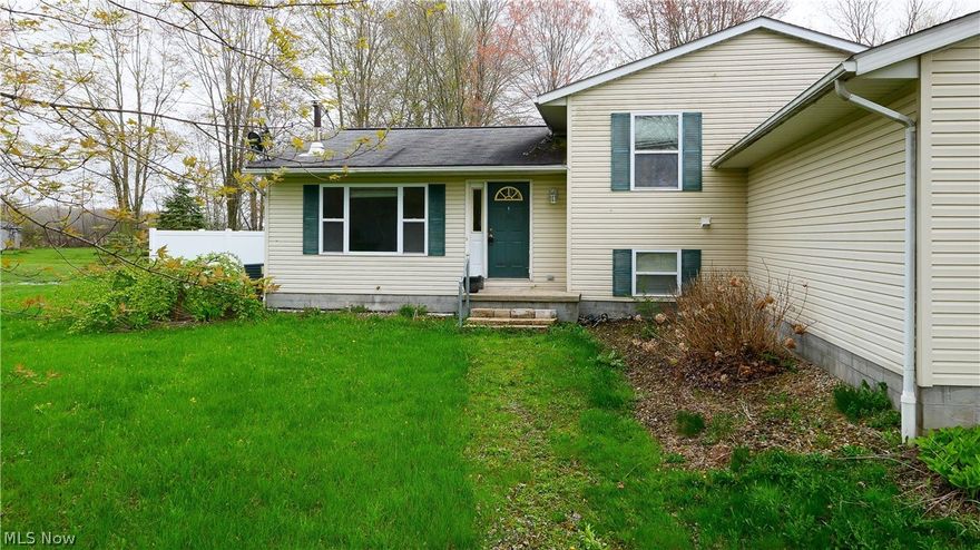 This well-maintained home has so much space! Walk in the front door to your living room, featuring a wood-burning stove to keep the home cozy in winter and energy bills low. An updated kitchen complete with all appliances and dining area create an open floor plan. Off the dining area, there is a large, covered deck overlooking a fenced-in backyard. Upstairs, you’ll find three bedrooms, including the master with it’s own bathroom, and an additional full bathroom. Downstairs, there is an over-size family room, mud room, and office or craft space with access to the attached two-car garage. In the basement, there are two rooms finished for more living space, potentially two more bedrooms. There is also a mechanical room with laundry in the unfinished portion of the basement. All of this is on 1.881 acres in James A Garfield Local school district. Upgraded home warranty offered. Don’t wait on this one! It will be gone quickly!