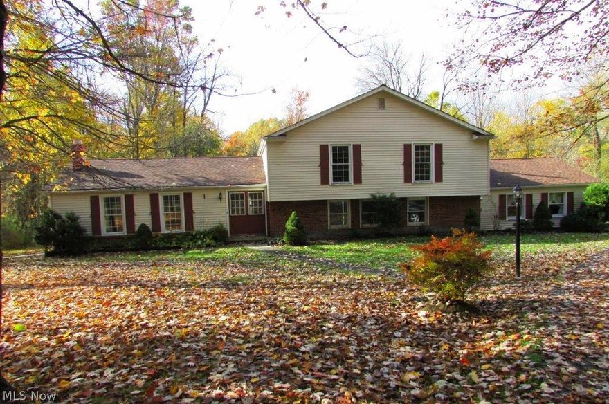 Wow! Fantastic split on wooded, scenic 1.74 acres of privacy! Roof 12/2013. Home 90 percent redone interior, all carpet, paint etc. in summer of 2014. Schrock maple kitchen 8/2014 - beautiful! 2 fireplaces: one in family rm, one in living rm. Family rm 3 steps down from kitchen. Newer boiler. Barn on property. Three Full baths! Great value and move-in condition. (Drive just sealed 10/2014!)