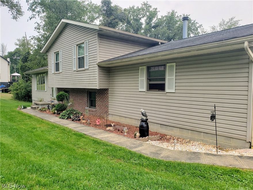 Tons of living space in this well taken care of multi-level home. 3 bdrms on the top floor and a large bonus room used as a bedroom on the lower level. Over an acre of land just outside of town!  Per owner: Fresh paint in most of the house, dry basement, new flooring in living/dining room and carpet on steps and hallway, newer hot-water tank, installed a ridge vent in roof, replacement windows and sliding glass door in rec-room. Radon mitigation system in place. Bonus room/4th bedroom in lower level was built in 2017 with a 7x7 closet. Fireplace is wood-burning but current owners use an insert. This is the one!!!