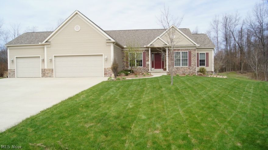 Immaculate Ranch, 3 bedrooms, 2.5 baths, Open floor plan, formal dining rm w/ medallion ceiling.Separate office w/ fr. doors, Modern Kitchen w/ maple cabinets & solid surface counter top. Stainless Steel appliances. Sunroom w/ cathedral ceiling & slider to patio and water feature. 9 ft ceilings through out the main level. Master suite has walk in closet, master bath has dual sinks, garden tub, and a shower. Combination of hardwood floors, ceramic floors and carpet. The finished basement is 26x42 and has a wet bar and large half bath. 3 car garage w/ 2 drains and H/C water.Home was custom built with attention to detail everywhere. Privacy of being located on culdesac in much desired King Ridge. Kent mailing address in Brimfield Twp. Conveniently located near I-76, Kent State, & Northeast Ohio Medical University. Home warranty offered.