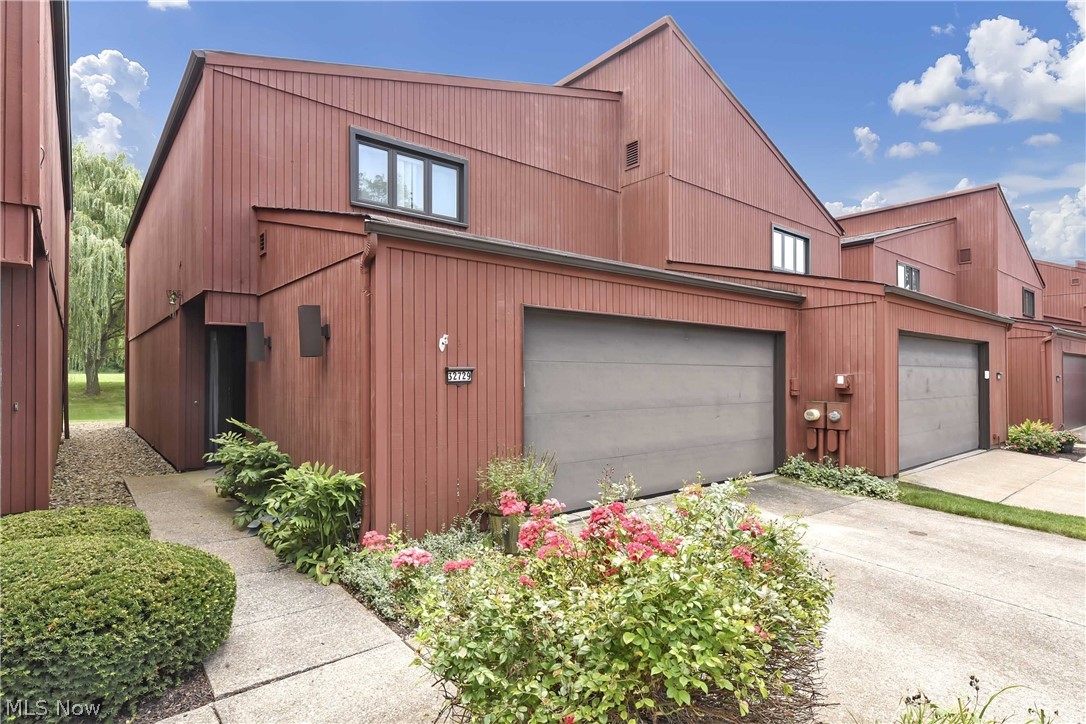 Prepare to be Moved!...into this spacious North Ridgeville condo in a beautifully wooded setting. This 2-story unit features two bedrooms and full bath plus laundry with utility sink on the main level. Upstairs, the living room features a fireplace, large picture window and door to the deck. The open floor plan flows to the dining room and eat-in kitchen with great cabinet space. Enjoy wooded views from the Master Bedroom with en-suite bathroom and walk in closet. Two car attached garage with opener. The large deck overlooks a community park with tennis courts, playground and paths. Enjoy nature and private feeling! Welcome home to carefree living at its best.