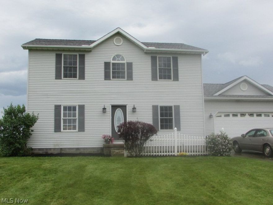 Welcome home to this cozy 1900 sq ft Colonial that sits on 2 acres.  Walk in to a warm and inviting living room with wood floor.  Freshly painted kitchen with door opening to large deck that is ready for you to add the pool on to! Many fun days and quiet evenings to watch the wild life and I'm told fireworks from surrounding areas from the deck.  Fenced in yard and attached 2 car garage.  A partially finished 13 core basement with many areas to make your own and plenty of storage.  The upstairs features a master suite with walk in closet, 2 large bedrooms with fresh paint and new carpet.