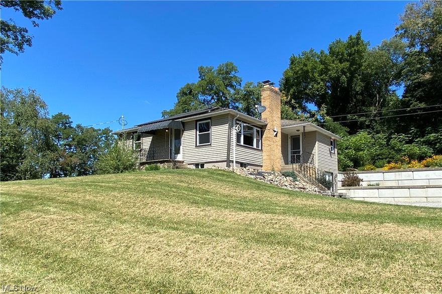 Country living conveniently located minutes from US 30 featuring a 3BR/1BA ranch home with a walk-out basement, 32'x30' 2-story bank-barn, pasture, large lawn space, and a small, wooded area with a trail. This 2.5 acre mini farm is ideal for experiencing the rural lifestyle, creating the perfect space for 4H opportunity, or hobby farm. Grape vines, rhubarb, and lots of space for a garden. Pasture has high-tensile wire fence. Barn was built in 2014 with a poured wall foundation, 2 stalls in the lower-level w/water hook up, and storage area on the upper floor. Utilities include well/septic, wood burner, propane. Home has spray foam insulation in all exterior walls, and attic has been insulated - makes the home very efficient with keeping it warm in winter, and cool in the summer. Roof and Yoder windows all less than 10 years old. 10x16 dog kennel stays. Call today for your private showing!