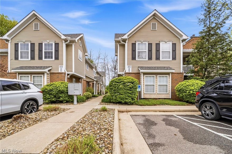 Tucked into Lenox Village, this 2-bedroom, 2-bath Fairlawn condo delivers the kind of low-maintenance living buyers are looking for, with space, storage, and comfort already built in. Vaulted ceilings in the living room and primary bedroom add an airy feel, while the gas fireplace and private balcony overlooking green space bring in the cozy factor. The kitchen features white cabinetry, an electric stove, included appliances, and a spacious pantry/laundry area with washer and dryer included. Both bedrooms offer walk-in closets, and the flexible work nook is ideal for a home office, reading space, or everyday drop zone. Additional perks include a Nest smart thermostat, SimpliSafe security system, extra storage closets, cement slabs between floors for sound control, and a detached 1-car garage. Conveniently located near Fairlawn shopping, dining, parks, highway access, and within the Copley-Fairlawn City School District.