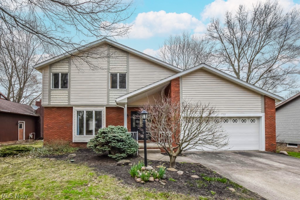 Beautifully remodeled 3 bedroom, 2.5 bath colonial with a finished lower level! This move-in ready home boasts a newer roof, gutter guards, gutters, downspouts, furnace, A/C and hot water tank in 2021 plus a modern kitchen and updated bathrooms! The foyer entry with built-in coat rack has sight lines into the living room as well as into the stunning kitchen with white cabinetry, quartz countertops, stainless steel appliances, tile backsplash, a pantry and a breakfast bar! There's also a dining room for larger gatherings. The adjacent great room with vaulted ceilings and deck access offers the perfect spot to unwind. A convenient half bath rounds out the 1st floor . Upstairs, the master suite offers a walk-in closet and a private full bath with a tiled walk-in shower. There are 2 additional bedrooms and a full bath with tile shower surround and twin vanities set against a shiplap wall. The full basement adds extra living space with a finished rec room as well as fantastic storage on the utility side. Wonderful turn key home nestled on a park-like lot, close to all amenities! Call to schedule your showing today.