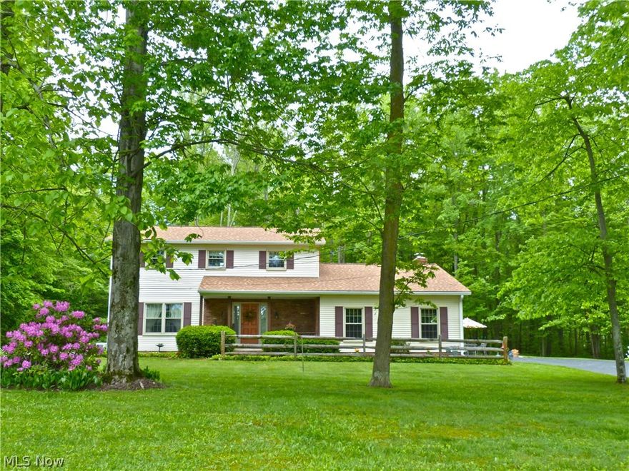 Great curb appeal on this brick highlighted colonial on 2.57 acre lot with 200' frontage. Peaceful, manicured lot and wooded back yard. Covered front porch to ceramic foyer, formal living room and dining room, ceramic eat in kitchen with all appliances, planning desk & ceramic counter tops, first floor laundry room, sun room with nature stone flooring, step down family room with vaulted ceiling, built in entertainment unit and brick fireplace, master suite with full bath & ceramic shower, newer carpet upstairs, rec room with large dry bar, workshop, storage shed, 2 car att. with stone flooring, security system, humidifier, water softener, patio, 4 yr old roof, 4 yr old furnace and C/A, 4 yr.old HW tank, whole house generator plus 12 mo. home warranty.